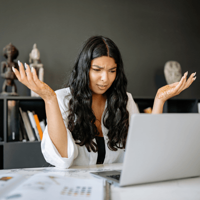 A Confused Woman Looking at her Laptop- Business Owner mistake was neglecting an onboarding process